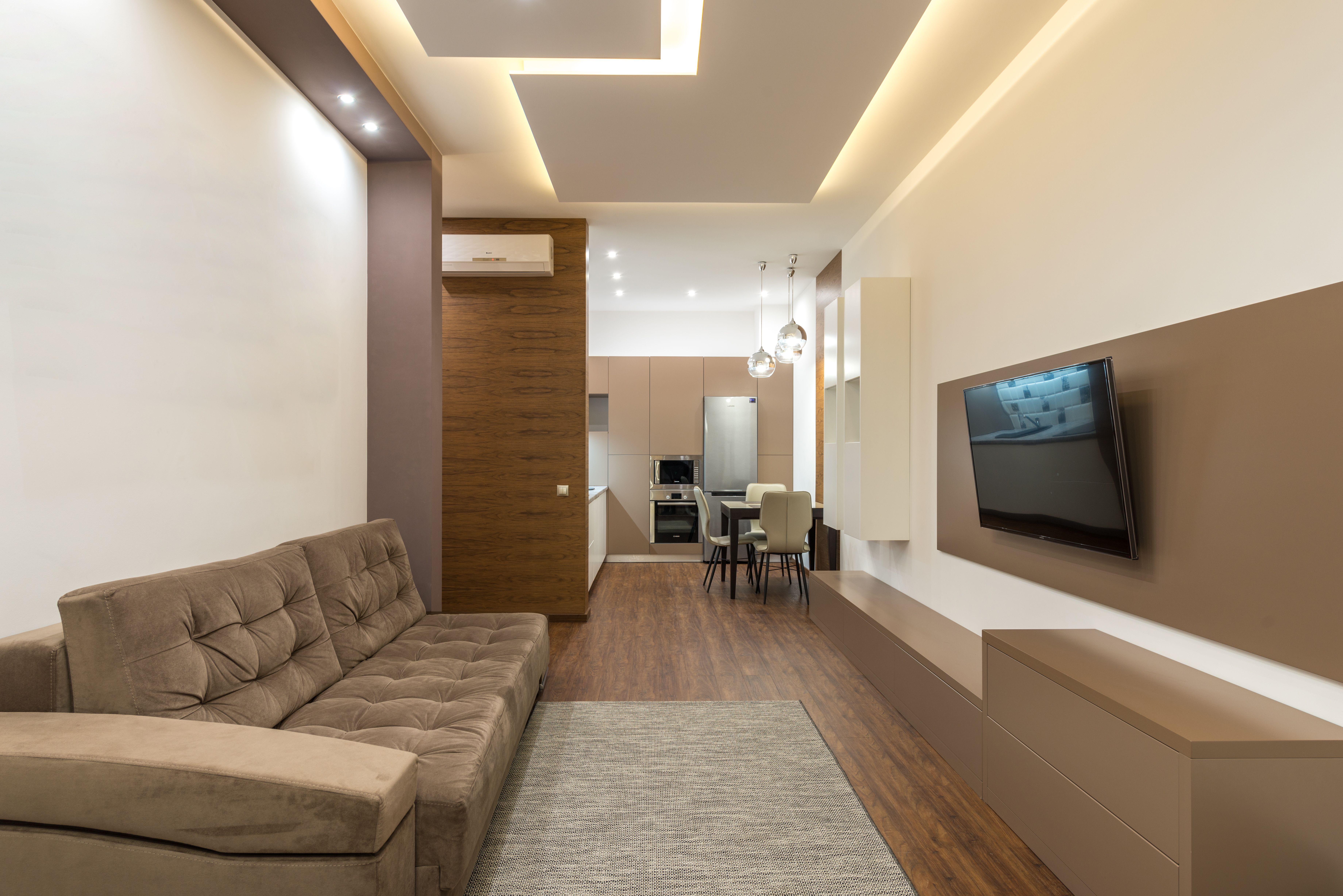Prestazio rénovation intérieure, salon fini avec canapé et décoration moderne